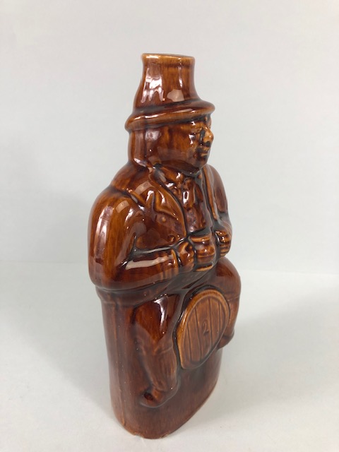 20th century treacle salt glaze bottle in the shape of a man sat on a barrel approximately 23cm - Image 2 of 7