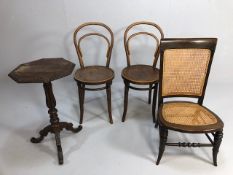 Two penny chairs, a low bergère wooden framed chair and a carved octagonal side table