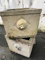 Two garden planters with lion head detailing
