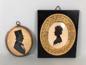 Antique Silhouettes, two framed 19th century silhouettes one of a gentleman in a top hat, hand