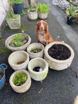 Collection of six concrete circular pots