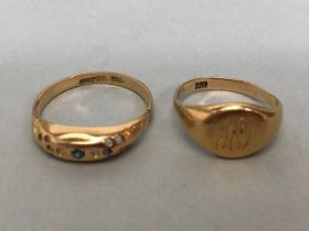 Two Gold rings one clearly marked 18ct (1.7g) missing stones (A/F) the other pinky ring signet