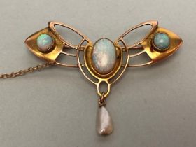 9ct Gold Brooch in the Art Nouveau Style set with three Opals and a drop seed pearl with safety