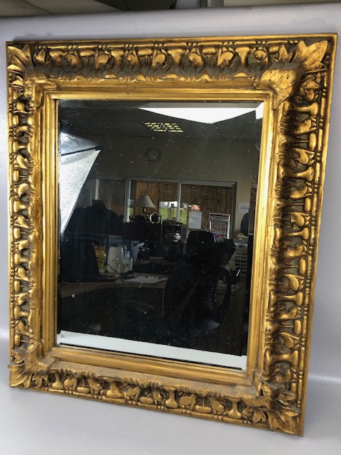 Vintage bevelled glass mirror set in a thick Rococo style gilt wooden frame approximately 62cm x
