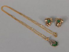 9ct Gold chain and a 9ct Gold pendant with matching 9ct Gold earrings all set with gemstones (