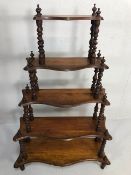 Antique furniture, Victorian waterfall whatnot of five tapered shelves supported by twisted