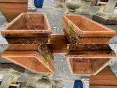 Four terracotta rectangular garden planters