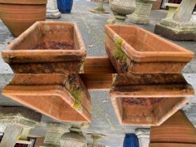 Four terracotta rectangular garden planters