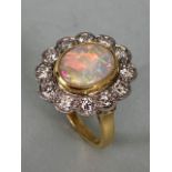 18ct Yellow Gold Opal & Diamond cluster ring the Oval cut Opal set in a tellow gold rope design