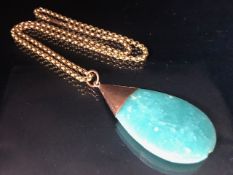 Polished Large pear shaped green gemstone on 9ct rose gold mount with 9ct Rose Gold chain (approx
