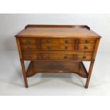 Mahogany occasional table with nine drawers and shelf under