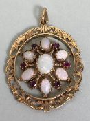 19th century Oval fretwork Victorian pendant set with rubies and opals in a snowflake design,