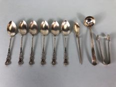 Collection of silver spoons and sugar nips (9) total weight approx 91g