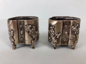Pair of Chinese Export Silver metal wash pots of amoebic shape decorated with cherry blossom trees