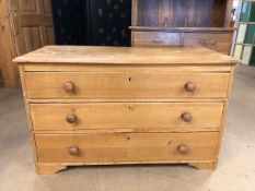 Antique pine low chest of three drawers with bun handles, approx 110cm x 48cm x 67cm tall