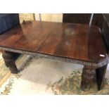 Victorian Oak Dining table on heavily carved tapering legs on casters with wind out mechanism to