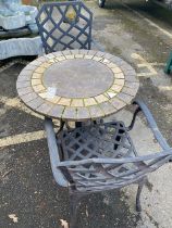 Bistro style tile topped circular table and two carver garden chairs, approx 70cm in diameter