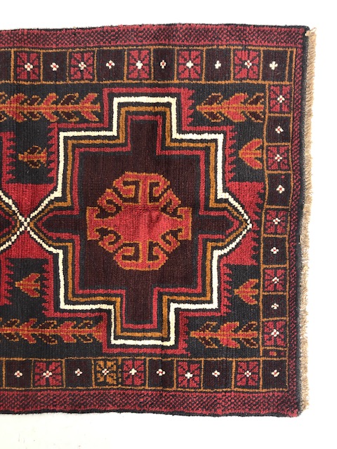 Oriental hand knotted wool carpet Baluchi geometric patterns on a dark burgundy background - Image 2 of 5