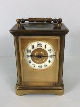 Antique Carriage clock, late 19th Century with once gilded brass case set with glass panels,