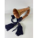 Musical instruments, vintage military brass bugle with blue tassel cords marked Dallas London.