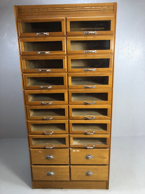 Vintage light oak haberdashery cabinet / shop keepers unit fitted with 16 glass fronted drawers