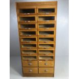 Vintage light oak haberdashery cabinet / shop keepers unit fitted with 16 glass fronted drawers