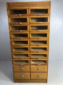 Vintage light oak haberdashery cabinet / shop keepers unit fitted with 16 glass fronted drawers