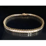 9ct Gold Tennis style bracelet marked 375 CZ and approx 19cm in length total weight 9.9g