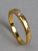 18ct Gold Band set with a single cushion cut Diamond size approx 'T' and total weight approx 4.5g