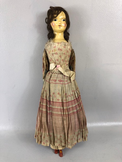 Antique doll, early 19th Century wood and cloth bodied doll with painted gesso face, silk clothes