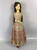 Antique doll, early 19th Century wood and cloth bodied doll with painted gesso face, silk clothes
