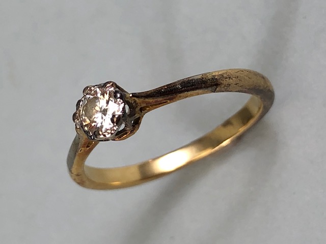 Gold Solitaire ring set with a single diamond, no hallmarks, approx .33ct and size 'K' total