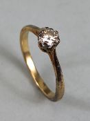 Gold Solitaire ring set with a single diamond, no hallmarks, approx .33ct and size 'K' total