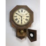 Antique clocks, continental pendulum wall clock, wooden case, white face with roman numerals, not
