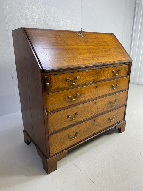 Oak Bureau with four drawers, fall front revealing pigeon holes and ornate key to lock approx 97 x - Image 2 of 14