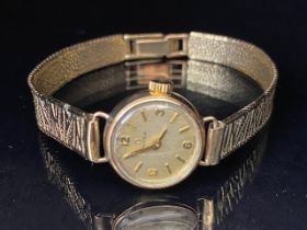 9ct gold vintage 1960s ladies OMEGA wrist watch on 9ct gold bark finish bracelet total length