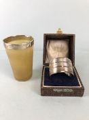 Hallmarked silver rimmed horn toast cup and a cased hallmarked silver napkin ring (46.5g)