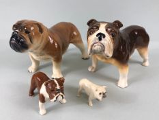 Ceramic Bulldogs, four bulldog figures of varying size, one with Coppercraft trade label to base,