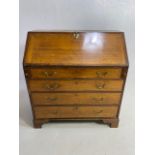 Oak Bureau with four drawers, fall front revealing pigeon holes and ornate key to lock approx 97 x