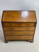 Oak Bureau with four drawers, fall front revealing pigeon holes and ornate key to lock approx 97 x
