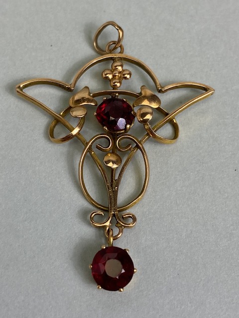 Antique jewellery, Art Nouveau unmarked rose gold metal pendant set with two garnets, - Image 2 of 5