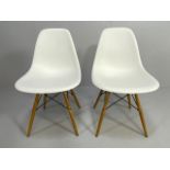 Vitra Eames, design Charles and Ray Eames, pair of white plastic moulded chairs
