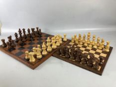 Vintage chess sets, two boxwood chess sets with boards, one approximately 30 x 30cm the other 40 x