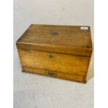 Antique oak slope top writing box with stationary and ink compartments internal bar lock for draw