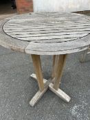 Circular teak garden table approx 70cm in diameter