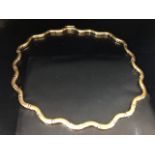 14ct Gold white and yellow gold necklace of wavey form approx 45cm in length and 29g