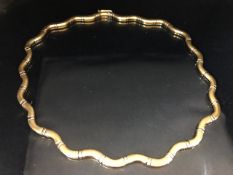 14ct Gold white and yellow gold necklace of wavey form approx 45cm in length and 29g