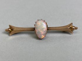 Unmarked antique gold bar brooch set with a pear shaped opal approximately 5 x 10mm, total weight