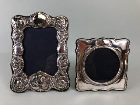 Silver Hallmarked photo frames, one of square Art Nouveau style with round aperture approximately 14