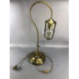 Contemporary table or desk lamp by maker FEISS in a brass finish approx 73cm tall on a stepped